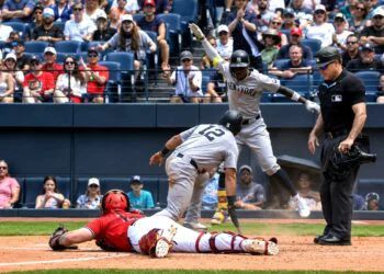 Jazz Chisholm celebrates after Trent Grisham slides into the plate in the sixth in the Yankees' 8-4 win over the Guardians in Cleveland, June 10, 2026.