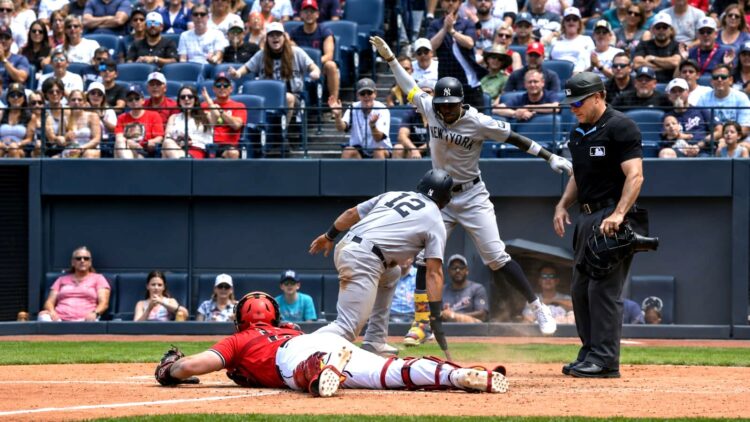 Jazz Chisholm celebrates after Trent Grisham slides into the plate in the sixth in the Yankees' 8-4 win over the Guardians in Cleveland, June 10, 2026.