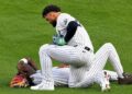 Jasson Dominguez check with Jazz Chisholm Jr. after a collision left him injured during the Yankees' 7-2 loss to the Tigers in New York, Jun 30, 2026.