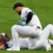 Jasson Dominguez check with Jazz Chisholm Jr. after a collision left him injured during the Yankees' 7-2 loss to the Tigers in New York, Jun 30, 2026.