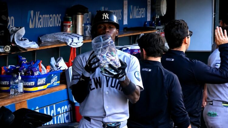Jazz Chisholm shows up a case of lollipops after hitting a home run in the Yankees' 4-3 win over the Tigers, Detroit, Jun 23, 2026, in apparent reference to outrage over his Blow Pop act a day before.