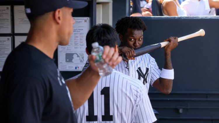 Aaron Judge looks at as Jazz Chisholm kisses his bat in the dugout during the Yankees' 6-1 rout of the Red Sox in New York, June 7, 2026.
