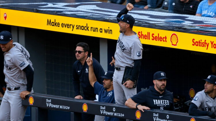 J Escarra and dugout react to the Goldschmidt's home run in the ninth in the Yankees' 3-1 win over the Blue Jays, Toronto, June 13, 2026.