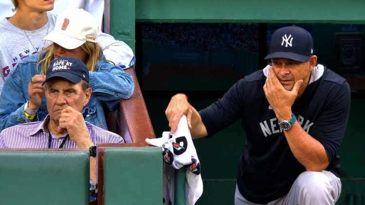 Ex-manager Joe Torre watches as Aaron Boone stands in the dugout during the Yankees' 6-1 loss to the Red Sox, Boston, Jun 27, 2026.
