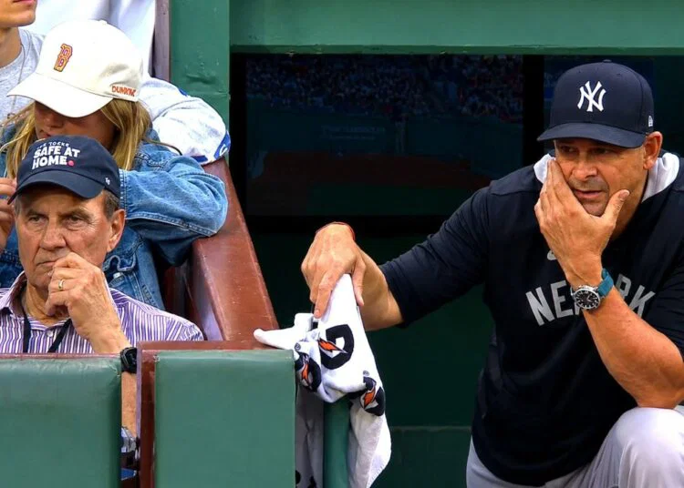 Ex-manager Joe Torre watches as Aaron Boone stands in the dugout during the Yankees' 6-1 loss to the Red Sox, Boston, Jun 27, 2026.