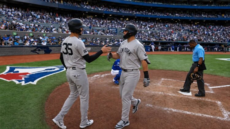 Cody Bellinger greets Paul Goldschmidt after his two-run homer in Yankees' 3-1 win over the Blue Jays, Toronto, June 13, 2026.
