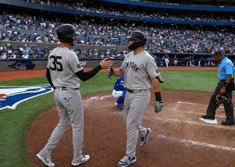 Cody Bellinger greets Paul Goldschmidt after his two-run homer in Yankees' 3-1 win over the Blue Jays, Toronto, June 13, 2026.