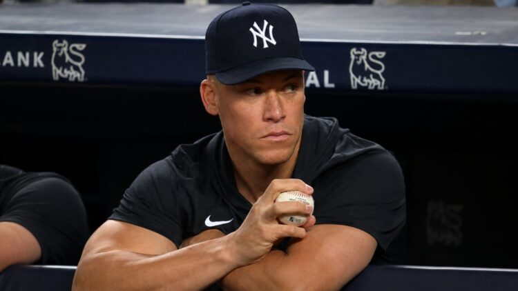 Aaron Judge watches from the dugout during the Yankees' 8-5 win over the Pirates, New York, July 20, 2026.