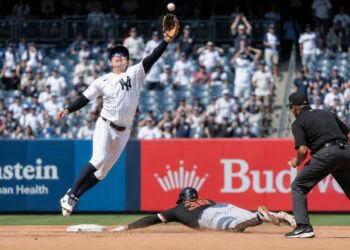 Anthony Volpe jumped as the throw went over him in 11th inning in the Yankees' 6-2 loss to the Tigers in New York, July 1, 2026.