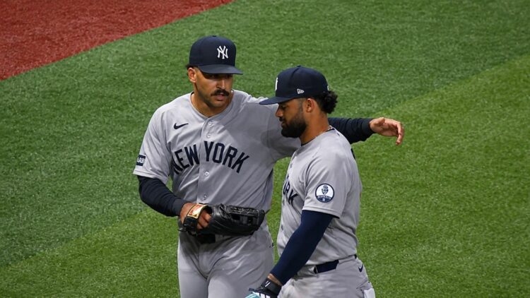Trent Grisham talks to Jasson Dominguez after both avoided near collision in the Yankees' 6-4 loss to the Rays in Tampa, July 7, 2026.