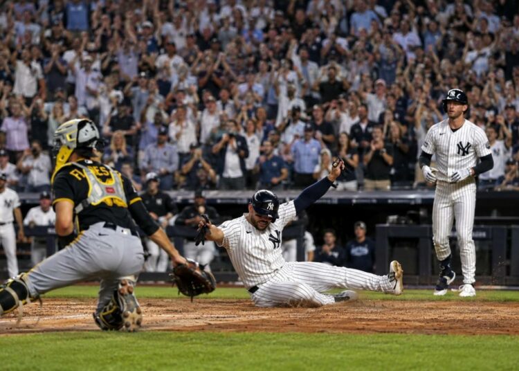Jasson Dominguez scores a run in the Yankees' 2-0 win over the Pirates, New York, July 22, 2026.