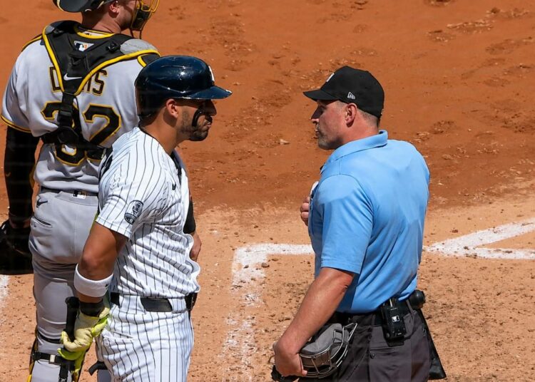 Jose Caballero argues with umpire after he was give automatic strikeout for pitch-clock violation in the Yankees' 5-3 loss to the Pirates, New York, July 22, 2026.