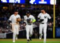 Ryan McMahon, Jose Caballero, and Cody Bellinger celebrate after the Yankees' 5-2 win over the Twins in New York, July 3, 2026.