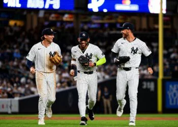 Ryan McMahon, Jose Caballero, and Cody Bellinger celebrate after the Yankees' 5-2 win over the Twins in New York, July 3, 2026.