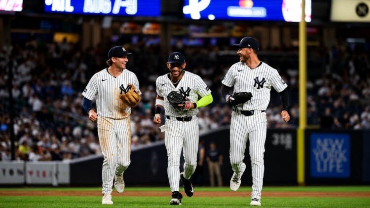 Ryan McMahon, Jose Caballero, and Cody Bellinger celebrate after the Yankees' 5-2 win over the Twins in New York, July 3, 2026.