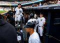 Trent Grisham and Ben Rice congratulate Goldschmidt after second run in the Yankees' 8-2 loss to the Dodgers in New York, July 19, 2026.