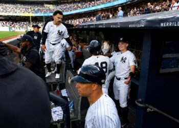 Trent Grisham and Ben Rice congratulate Goldschmidt after second run in the Yankees' 8-2 loss to the Dodgers in New York, July 19, 2026.