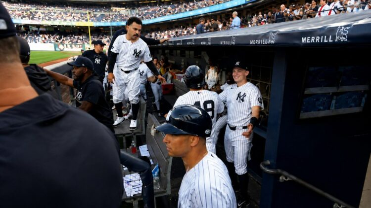 Trent Grisham and Ben Rice congratulate Goldschmidt after second run in the Yankees' 8-2 loss to the Dodgers in New York, July 19, 2026.