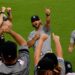 Manager Aaron Boone and coaches celebrated with fans after the Yankees' 5-3 win over the Orioles, Baltimore, August 19, 2026.