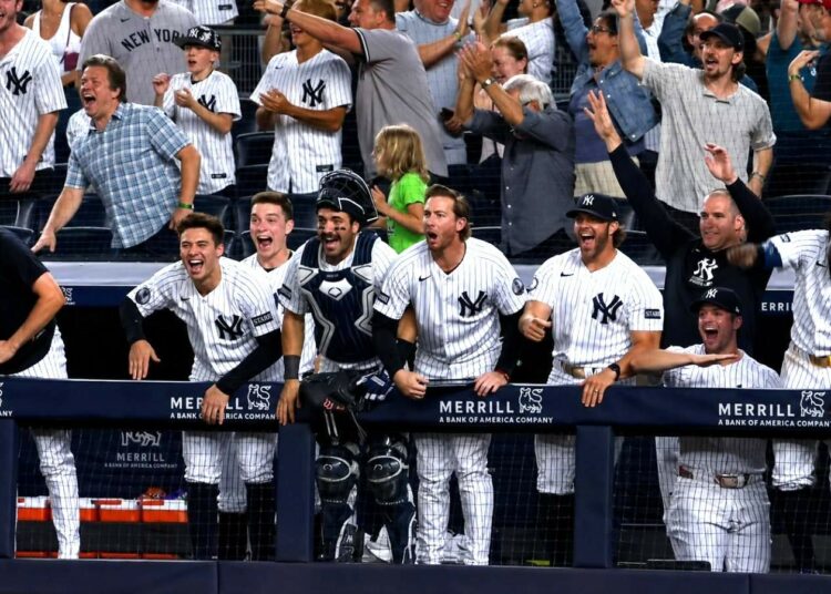 The Yankees dugout reacts to Luis Garcia Jr.'s debut homer in 13-7 loss to the Mariners, New Yor, August 3, 2026.