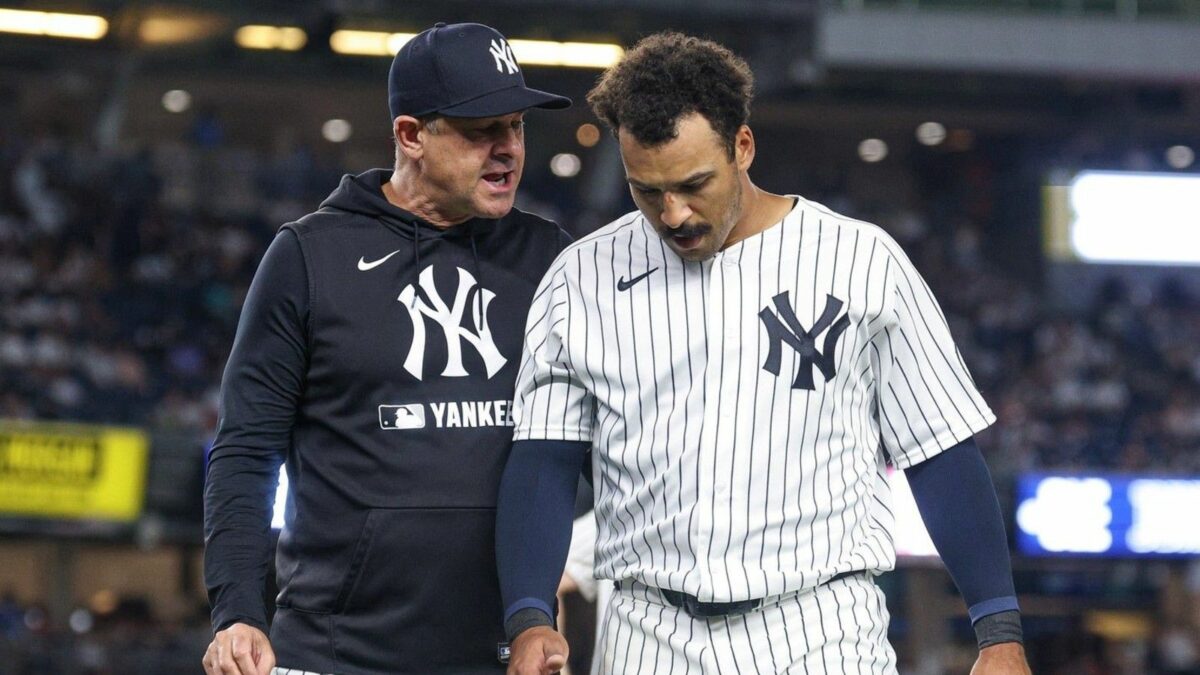 Yankees manager Aaron Boone and Trent Grisham in July 2026.