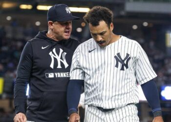 Yankees manager Aaron Boone and Trent Grisham in July 2026.