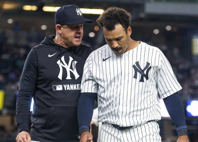 Yankees manager Aaron Boone and Trent Grisham in July 2026.