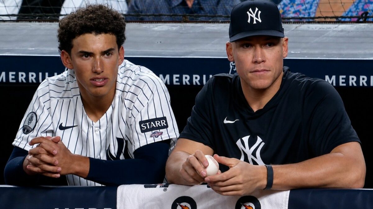 George Lombard Jr. and Aaron Judge are in the dugout during the Yankees' 2-0 win over the Cardinals, New York, August 4, 2026.