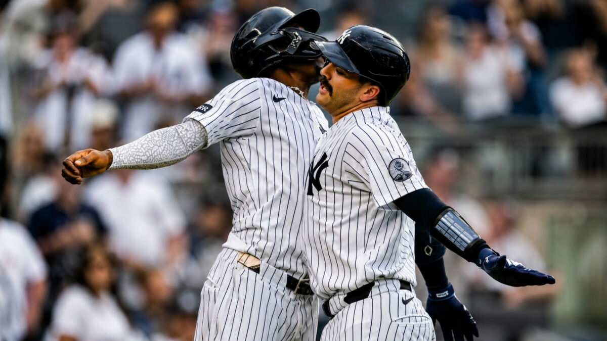 Jazz Chisholm and Austin Wells celebrate after the catcher's second homer in the eight in the Yankees' 16-1 win over the Red Sox, New York, August 30, 2026.