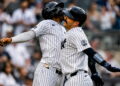 Jazz Chisholm and Austin Wells celebrate after the catcher's second homer in the eight in the Yankees' 16-1 win over the Red Sox, New York, August 30, 2026.