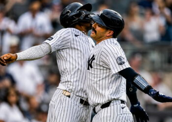 Jazz Chisholm and Austin Wells celebrate after the catcher's second homer in the eight in the Yankees' 16-1 win over the Red Sox, New York, August 30, 2026.