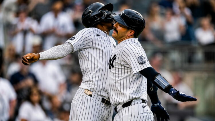 Jazz Chisholm and Austin Wells celebrate after the catcher's second homer in the eight in the Yankees' 16-1 win over the Red Sox, New York, August 30, 2026.
