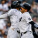 Jazz Chisholm and Austin Wells celebrate after the catcher's second homer in the eight in the Yankees' 16-1 win over the Red Sox, New York, August 30, 2026.
