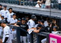 Pinch hitter Austin Wells gets hugs in the dugout after his second home run in the Yankees' 16-1 win over the Red Sox, New York, August 30, 2026.
