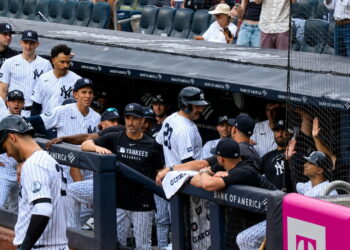Pinch hitter Austin Wells gets hugs in the dugout after his second home run in the Yankees' 16-1 win over the Red Sox, New York, August 30, 2026.