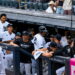 Pinch hitter Austin Wells gets hugs in the dugout after his second home run in the Yankees' 16-1 win over the Red Sox, New York, August 30, 2026.