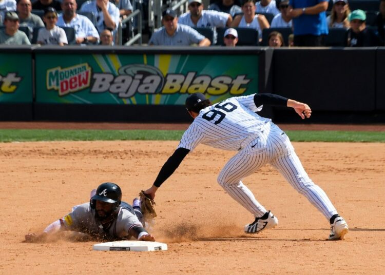 George Lombard Jr. tags Braves' Michael Harris II at 2B in the Yankees' 2-1 loss to the Braves, New York, August 9, 2026.