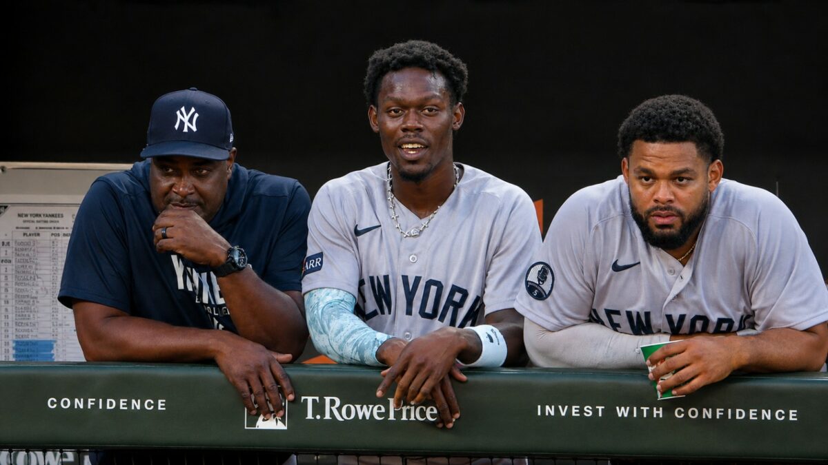 Hitting coach James Rowson, INF Jazz Chisholm and OF Heliot Ramos look at during the 6-1 Yankees win over the Orioles, Baltimore, August 20, 2026.