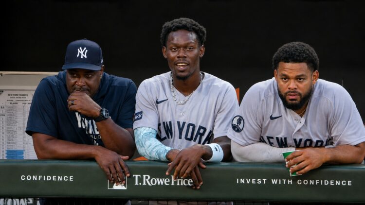 Hitting coach James Rowson, INF Jazz Chisholm and OF Heliot Ramos look at during the 6-1 Yankees win over the Orioles, Baltimore, August 20, 2026.