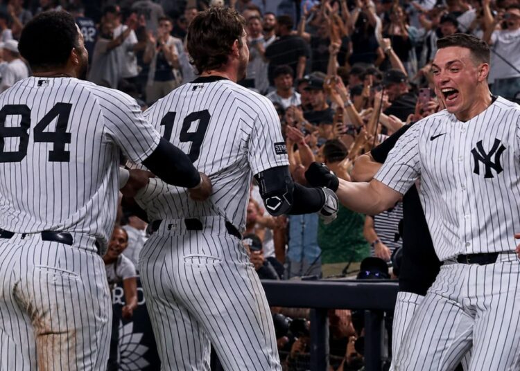 Ryan McMahon, Heliot Ramos and Ben Rice celebrate after the Yankees' 3-2 walk-off win over the Braves, New York, August 7, 2026.