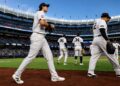 OFs Spencer Jones and Trent Grisham were returning to dugout after the Yankees' 10-5 win over the Mariners, New York, August 12, 2026.