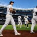 OFs Spencer Jones and Trent Grisham were returning to dugout after the Yankees' 10-5 win over the Mariners, New York, August 12, 2026.