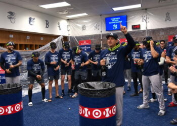 The Yankees celebrate their postseason clincher with champagne after 8-3 win over the Twins, Minnesota, September 14, 2026.