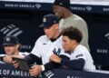 George Lombard Jr. and Aaron Judge are looking at an iPad during the Yankees' 10-3 win over the Rockies, New York, September 10, 2026.