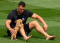 Aaron Judge is with his pet dog Gus before the Yankees' 7-3 win over the Angels, Anaheim, September 1, 2026.