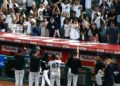 The Yankees players, manager, coach and the staff are doing the fist thing with fans after the 7-3 win over the Angels, Anaheim, September 1, 2026.