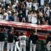 The Yankees players, manager, coach and the staff are doing the fist thing with fans after the 7-3 win over the Angels, Anaheim, September 1, 2026.