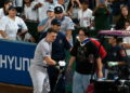 Ben Rice rushes to meet photographer Steven Park, who was hit by his foul ball, in the Yankees' 6-3 win over the Angels, Anaheim, September 2, 2026.