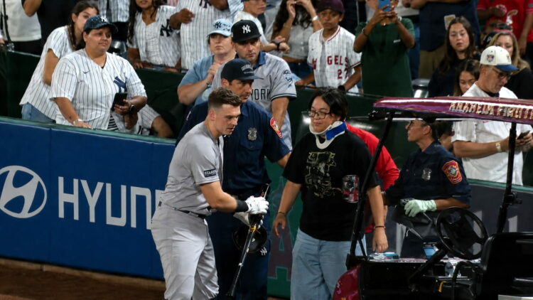 Ben Rice rushes to meet photographer Steven Park, who was hit by his foul ball, in the Yankees' 6-3 win over the Angels, Anaheim, September 2, 2026.