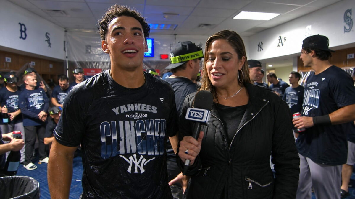 George Lombard Jr. talks to Meredith Marakovits at the clincher party after the Yankees' 8-3 win over the Twins, Minnesota, September 14, 2026.